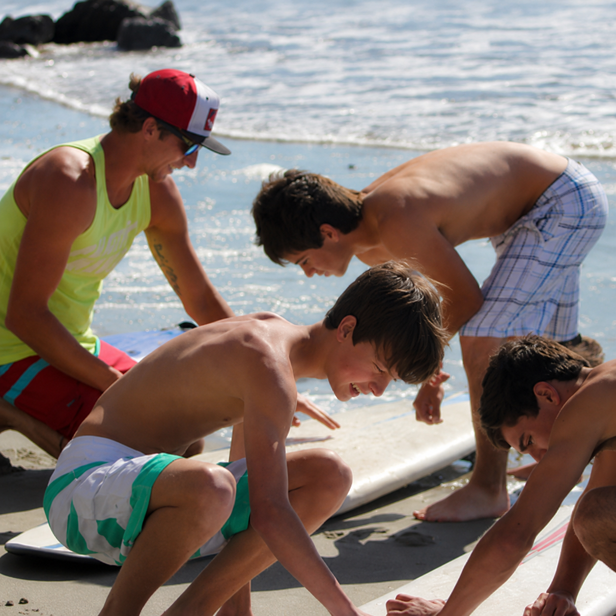 Kids learning to surf during Carolina Salt surf camp on Folly Beach
